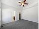 This bedroom offers plush carpet, a ceiling fan and ensuite bathroom and walk-in closet at 80 Somerset Dr, Franklinton, NC 27525