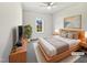Staged bedroom features a king bed, neutral tones, and a ceiling fan at 80 Somerset Dr, Franklinton, NC 27525