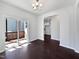This dining room features gorgeous hardwood floors, modern lighting, and slider to deck at 80 Somerset Dr, Franklinton, NC 27525