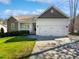 Charming home featuring a two-car garage, a cozy porch, and a well-maintained lawn at 80 Somerset Dr, Franklinton, NC 27525