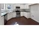 Bright kitchen with stainless steel appliances, tile backsplash, and white cabinets at 80 Somerset Dr, Franklinton, NC 27525
