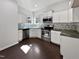 Bright kitchen with stainless steel appliances, tile backsplash, and white cabinets at 80 Somerset Dr, Franklinton, NC 27525