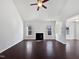 Bright living room features hardwood floors, high ceilings, and a fireplace at 80 Somerset Dr, Franklinton, NC 27525