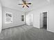 A large bedroom with carpet, ceiling fan and windows at 80 Somerset Dr, Franklinton, NC 27525