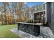 Backyard featuring an outdoor kitchen, covered porch, and greenery at 8201 Southmoor Hill Trl, Wake Forest, NC 27587