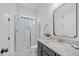 Clean bathroom featuring a tiled shower, granite countertop, and modern fixtures at 8201 Southmoor Hill Trl, Wake Forest, NC 27587