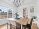 Elegant dining room with large windows, chandelier, and hardwood floors at 8201 Southmoor Hill Trl, Wake Forest, NC 27587
