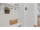 Well-organized mudroom with built-in bench, hooks, and shelves for storage at 8201 Southmoor Hill Trl, Wake Forest, NC 27587