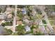 An aerial view that captures homes with mature landscaping, tree-lined streets, and a peaceful residential setting at 909 Lake Boone Trl, Raleigh, NC 27607