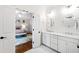 En suite bathroom has double sinks and direct bedroom access at 909 Lake Boone Trl, Raleigh, NC 27607