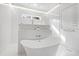 This bathroom has a glass-enclosed shower and free-standing tub at 909 Lake Boone Trl, Raleigh, NC 27607