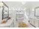 Expansive bathroom with dual vanities, a free-standing tub and a luxurious shower at 909 Lake Boone Trl, Raleigh, NC 27607