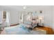 Bright bedroom with light walls and a custom rug at 909 Lake Boone Trl, Raleigh, NC 27607