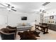 Open bonus room with multiple ceiling fans, a cowhide rug, seating, and a built in desk at 909 Lake Boone Trl, Raleigh, NC 27607