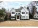 Well-maintained lawn and landscaping complement this home's exterior, enhancing its outdoor charm at 909 Lake Boone Trl, Raleigh, NC 27607