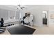 Well-equipped gym space with exercise equipment, natural light, and a view, promoting a healthy lifestyle at 909 Lake Boone Trl, Raleigh, NC 27607