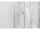 Tiled shower featuring glass door, seating, and modern fixtures, offering a luxurious bathing experience at 909 Lake Boone Trl, Raleigh, NC 27607