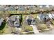 Aerial view of the house showcasing a long driveway and the beautiful houses that surround it at 9117 Cornwell Dr, Wake Forest, NC 27587