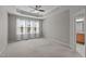 Spacious bedroom with a tray ceiling, large window, and neutral decor at 9117 Cornwell Dr, Wake Forest, NC 27587