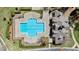 Aerial shot of the geometric-shaped community pool, surrounded by concrete and landscaping at 9117 Cornwell Dr, Wake Forest, NC 27587