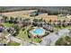 Aerial shot showcases a well-maintained community pool with ample seating and lush landscaping at 9117 Cornwell Dr, Wake Forest, NC 27587