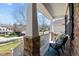 Charming porch offers a cozy outdoor seating area and neighborhood views at 9117 Cornwell Dr, Wake Forest, NC 27587