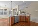 Kitchen boasts granite countertops, stainless steel dishwasher, and hardwood floors, great for modern cooking at 9117 Cornwell Dr, Wake Forest, NC 27587