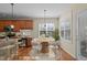 Open kitchen with seating area features stainless appliances, granite countertops, and natural light from the window at 9117 Cornwell Dr, Wake Forest, NC 27587