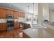 Spacious kitchen features stainless steel appliances, granite countertops, and beautiful hardwood flooring at 9117 Cornwell Dr, Wake Forest, NC 27587