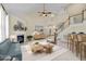 Inviting living room featuring a fireplace, vaulted ceilings, and staircase that leads to the upper level at 9117 Cornwell Dr, Wake Forest, NC 27587