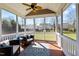 Relaxing screened porch with comfortable seating, decorative rug, and views of the well-maintained backyard at 9117 Cornwell Dr, Wake Forest, NC 27587