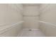 Empty walk-in closet with multiple shelves to organize and hang clothes and accessories at 9117 Cornwell Dr, Wake Forest, NC 27587