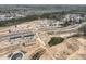 Expansive aerial view of a new residential development featuring modern homes and townhomes under construction at 10004 Secluded Garden Drive Rd # 180, Apex, NC 27523