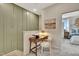 Cozy office nook featuring built-in desk and chair, next to a staircase and bedroom at 10004 Secluded Garden Drive Rd # 180, Apex, NC 27523