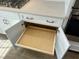 Kitchen storage space with a pull-out shelf at 10008 Secluded Garden Drive Rd # 182, Apex, NC 27523