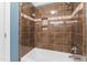 This bathroom features a shower-tub combo with tile surround and a built-in niche at 102 Caymus Ct, Cary, NC 27519