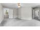 Bedroom featuring neutral walls, plush carpeting, a window, and an open door to the hall at 102 Caymus Ct, Cary, NC 27519