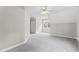 Bedroom showcasing gray carpet, light-colored walls, and natural light from the window at 102 Caymus Ct, Cary, NC 27519