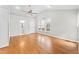 Spacious bedroom with hardwood floors, ceiling fan, and ensuite bathroom at 102 Caymus Ct, Cary, NC 27519