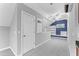 Bonus room showcasing gray carpet and a wall of built-in shelving at 102 Caymus Ct, Cary, NC 27519