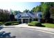 Attractive brick clubhouse with dormer windows and manicured landscaping for residents to enjoy at 102 Caymus Ct, Cary, NC 27519