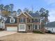 Beautiful two-story brick home with attached two car garage and well maintained lawn and landscaping at 102 Caymus Ct, Cary, NC 27519