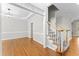 Elegant foyer with hardwood floors, staircase, and formal dining room at 102 Caymus Ct, Cary, NC 27519