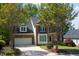 Attractive brick-front home with a well-kept lawn and mature trees at 102 Caymus Ct, Cary, NC 27519