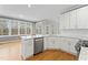 Well-lit kitchen with granite countertops and stainless steel appliances at 102 Caymus Ct, Cary, NC 27519