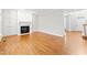Bright living room with hardwood floors and a fireplace at 102 Caymus Ct, Cary, NC 27519