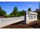 A well-kept neighborhood sign with tidy landscaping welcomes you to Highcroft Elementary School at 102 Caymus Ct, Cary, NC 27519