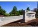Street view of the 'Highcroft Drive Elementary School' sign and well-manicured landscaping at 102 Caymus Ct, Cary, NC 27519