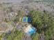 Aerial shot showcasing the community pool, tennis courts, and surrounding wooded area at 10509 Leslie Dr, Raleigh, NC 27615