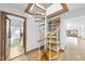 Unique spiral staircase featuring wood and white metal construction leading to multiple floors of the home at 10509 Leslie Dr, Raleigh, NC 27615